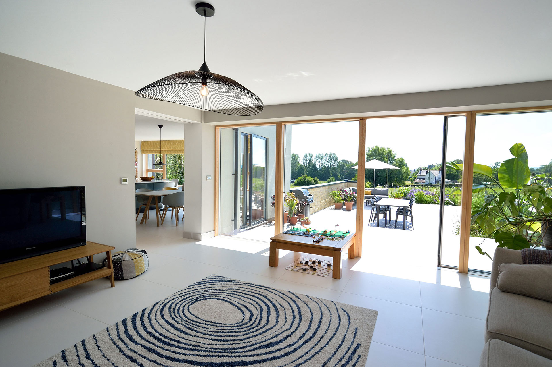 living area with double door leading to outside living space