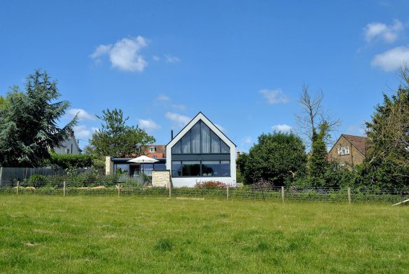 exterior rear view of house with glazed gable