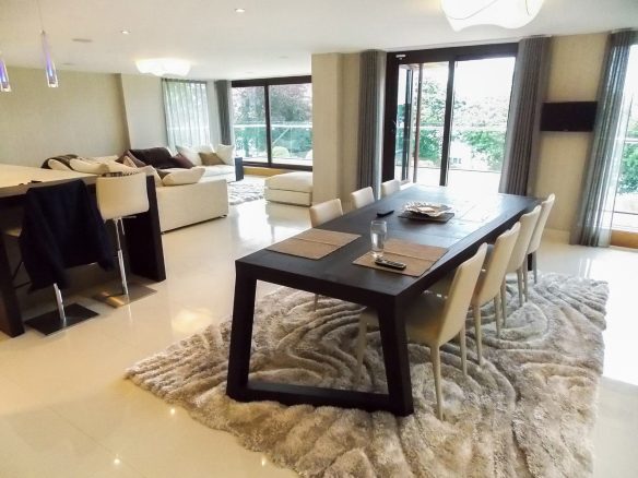 interior of modern open plan dining living room in white tones