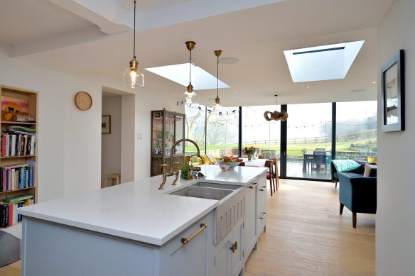 interior open-plan modern kitchen dining area with roof lights