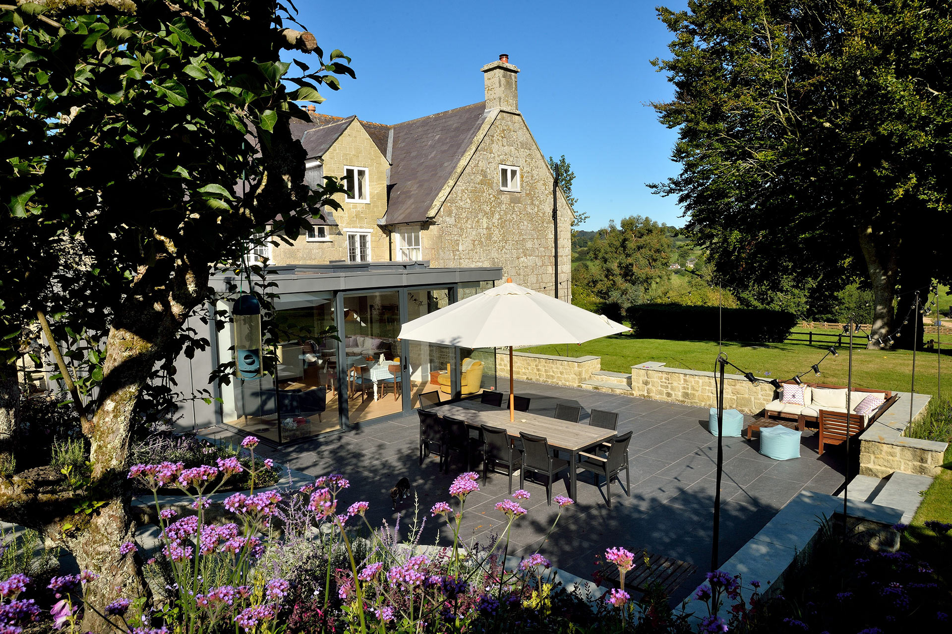 external view of garden and terrace in front of modern extension