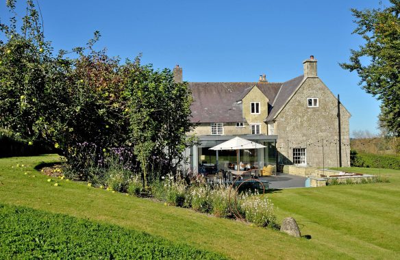 external view of garden and terrace in front of modern extension