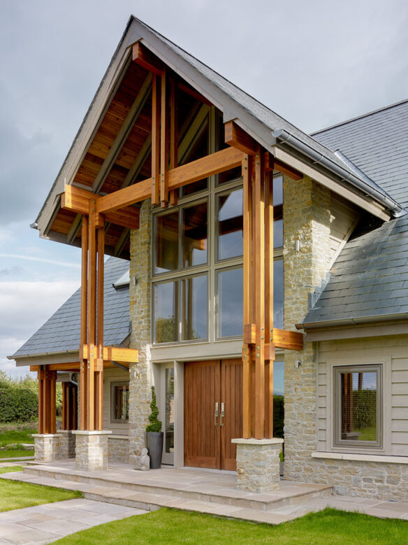 main entrance to North American style house with Lindab galvanised guttering and crisp Western red cedar