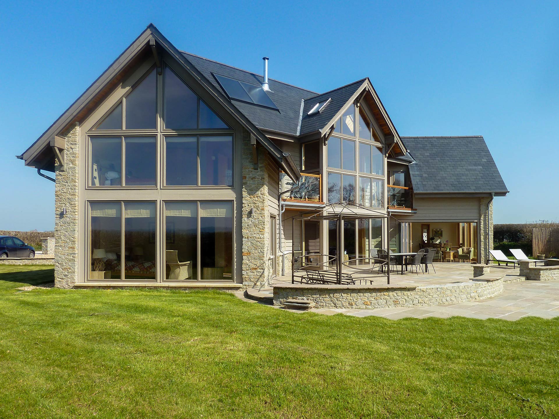 main entrance to North American style house with Lindab galvanised guttering and Western red cedar