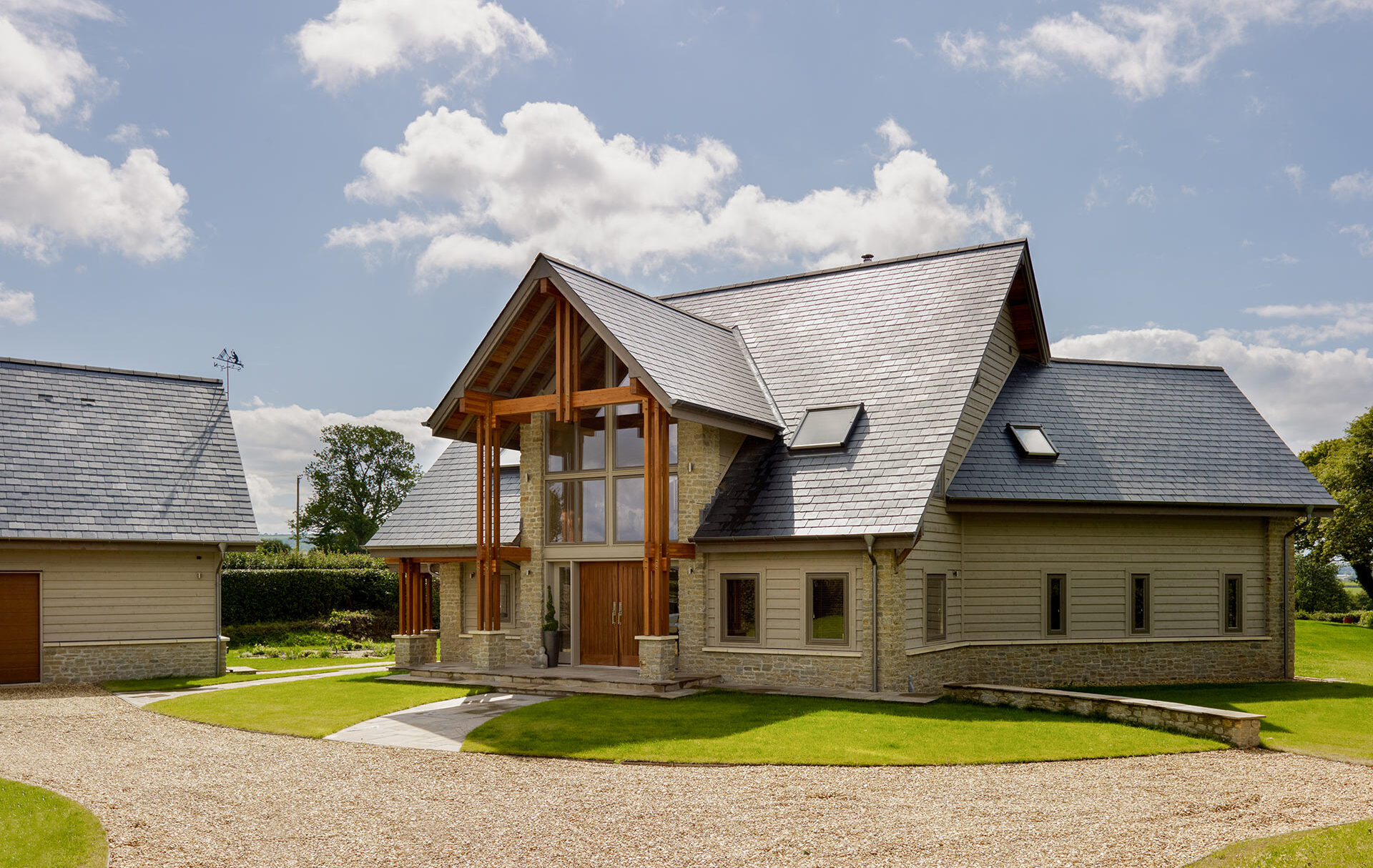 view of impressive pre-fabricated timber house from front drive