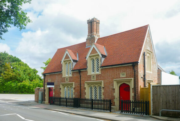 street view of old post office converted into house with red door