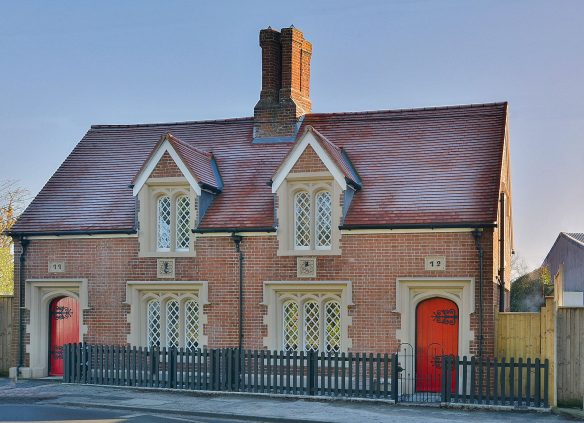 street view of old post office converted into house with red door