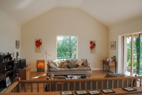 first floor living area with vaulted ceilings