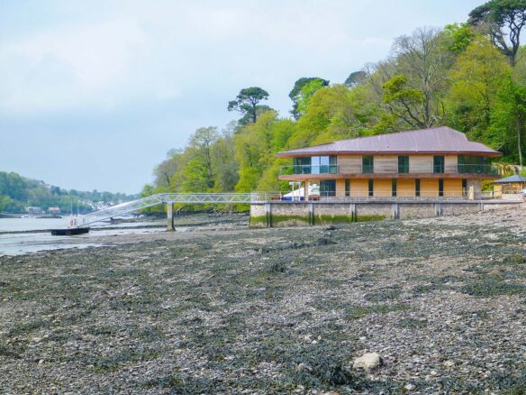 riverside house with pontoon from side taken at low tide