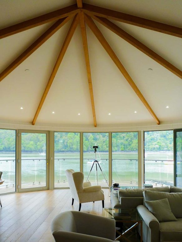 curved vaulted ceiling with exposed beams and beautiful river views