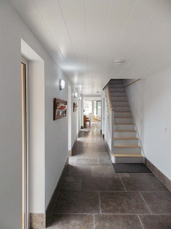 internal hallway in neutral tones with stairs