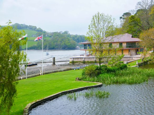 riverside house with pontoon clad in natural weathered oak shiplap cladding