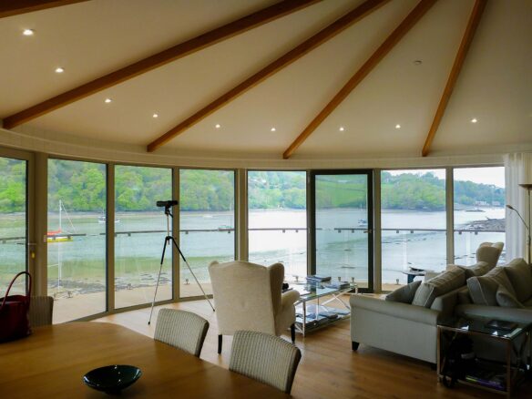 curved vaulted ceiling with exposed beams and beautiful river views