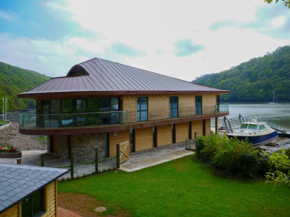 riverside timber clad house at low tide