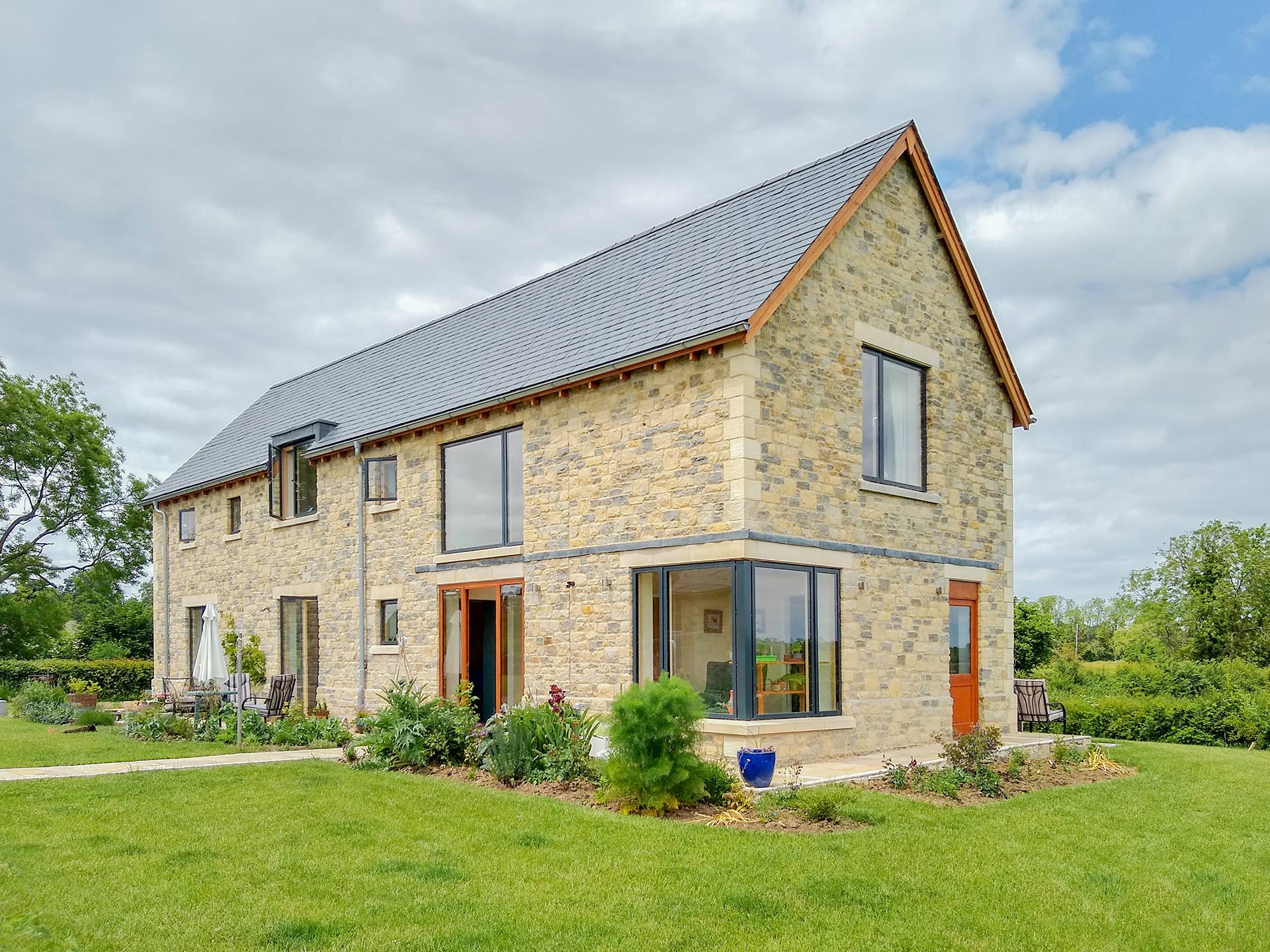 side view of stone house with corner window