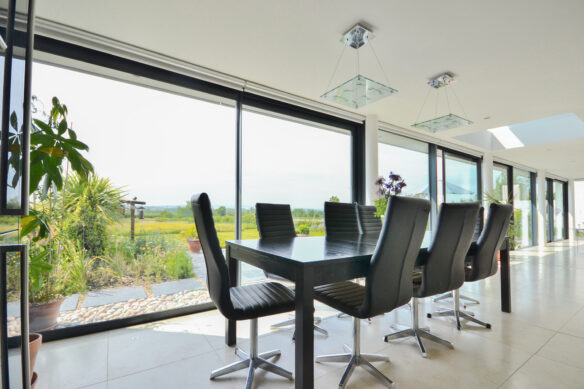 open plan dining space with large glass windows