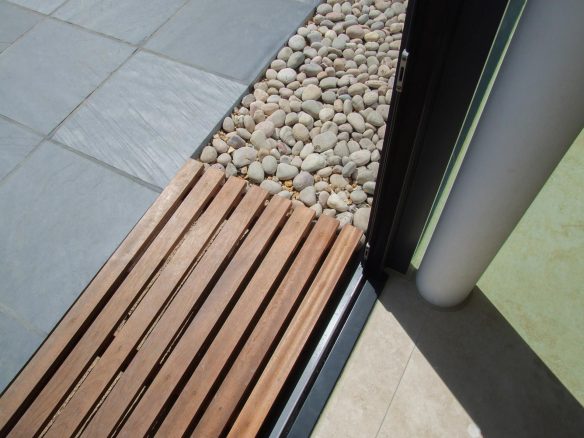 threshold with wooden slats connecting patio to inside