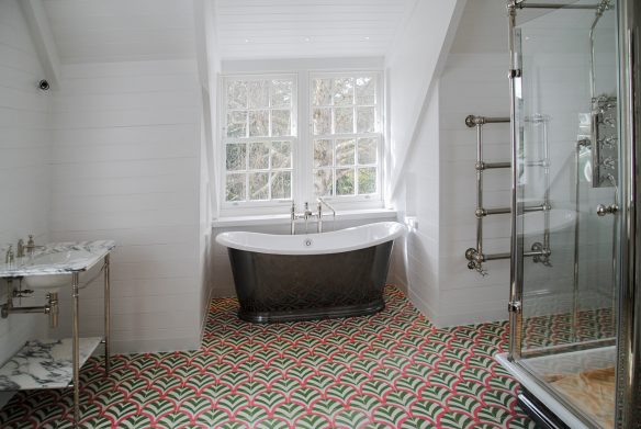 interior bright modern bathroom with black freestanding bath