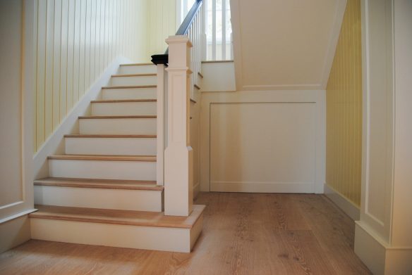 interior hallway and staircase with yellow walls