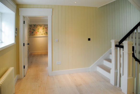 interior landing area with staircase with yellow walls