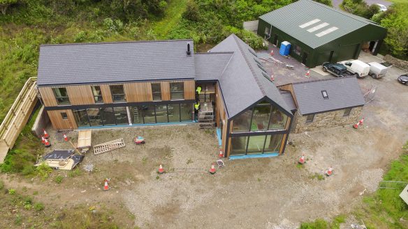 aerial photo of contemporary house with stone and timber cladding under construction