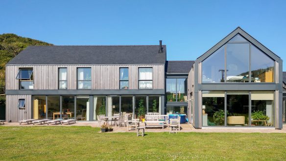 front view of contemporary timer clad house from garden