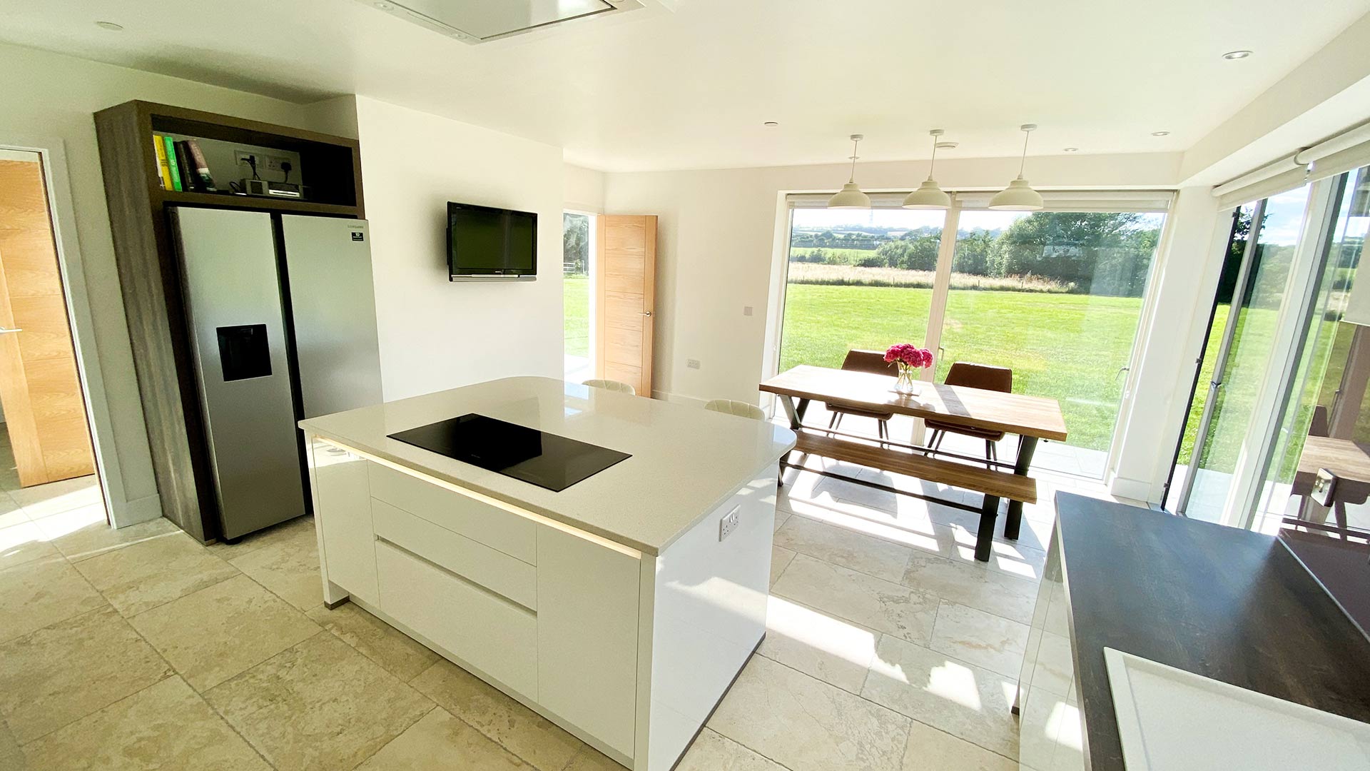 open plan modern kitchen dining area with lovely country views