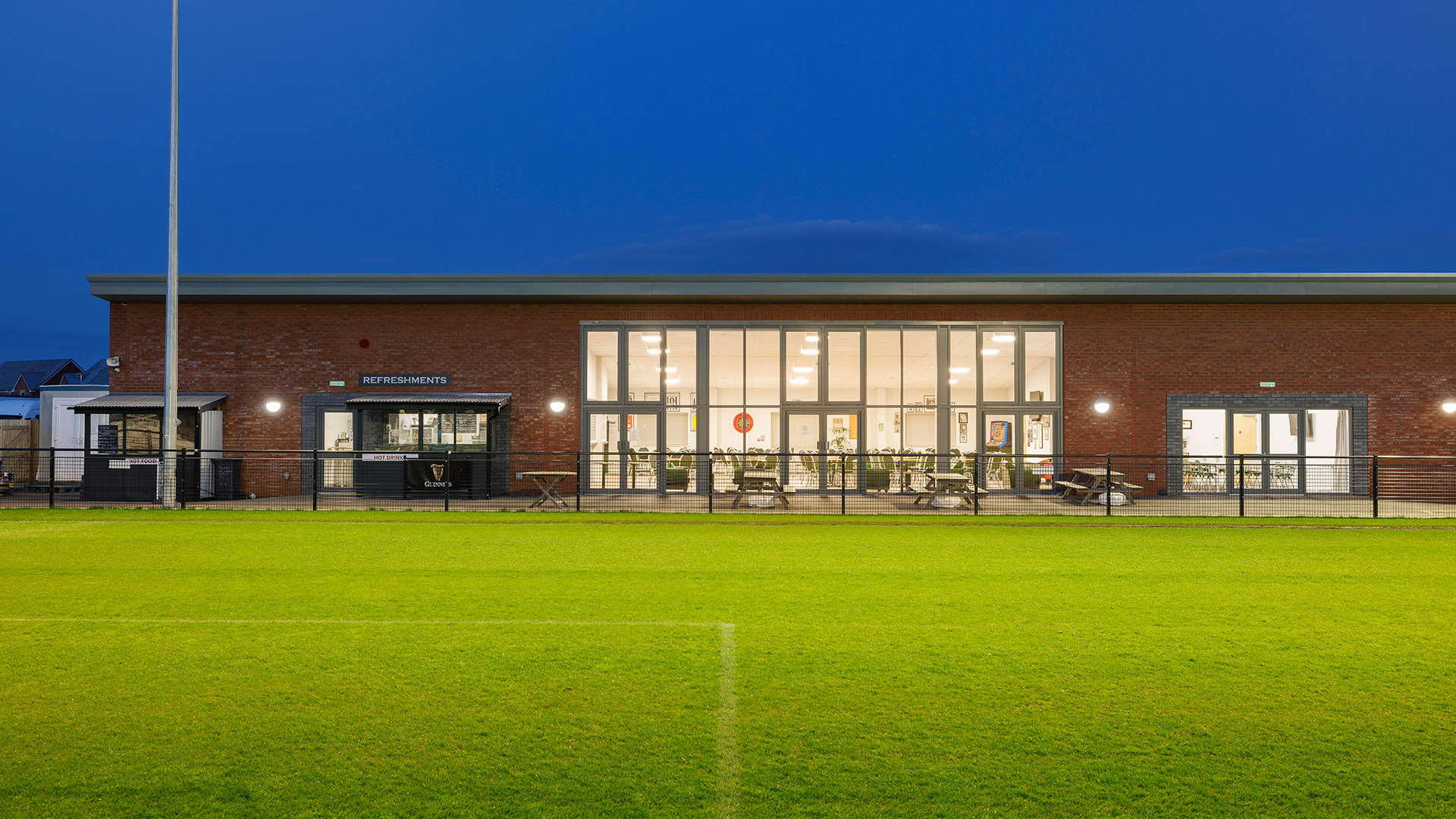 football club building at night lit up