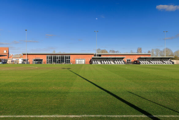 football pitch with new clubhouse in the background