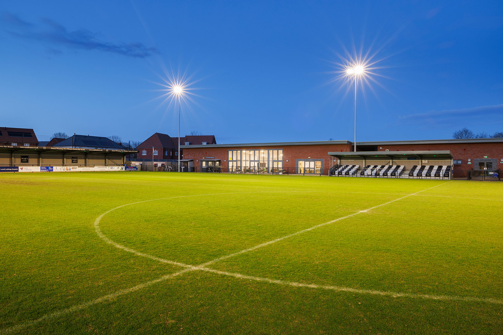 football club building at night lit up