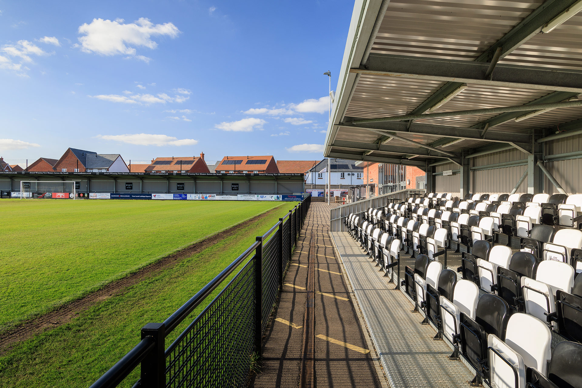 spectator seating area next to football pitch