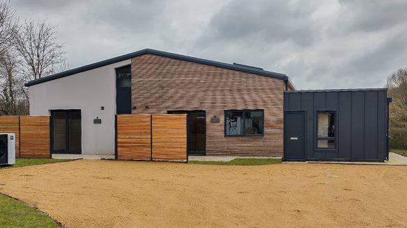 front view of barn conversion with zinc and timber cladding