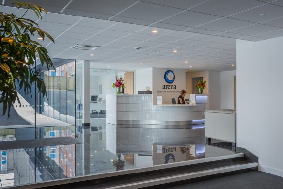 modern reception area of office building with desk and seating area