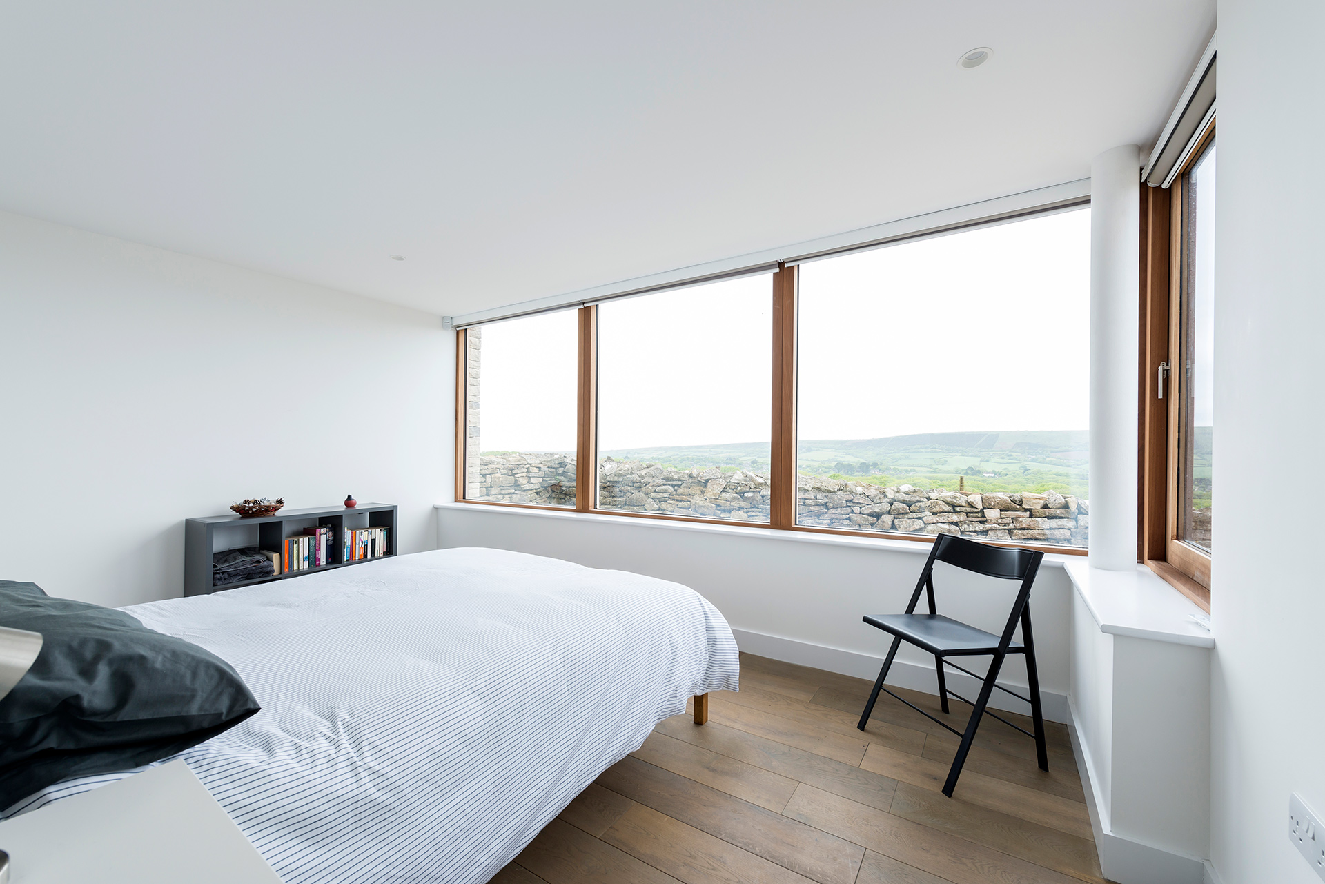 modern light bedroom with double aspect beautiful views of the countryside