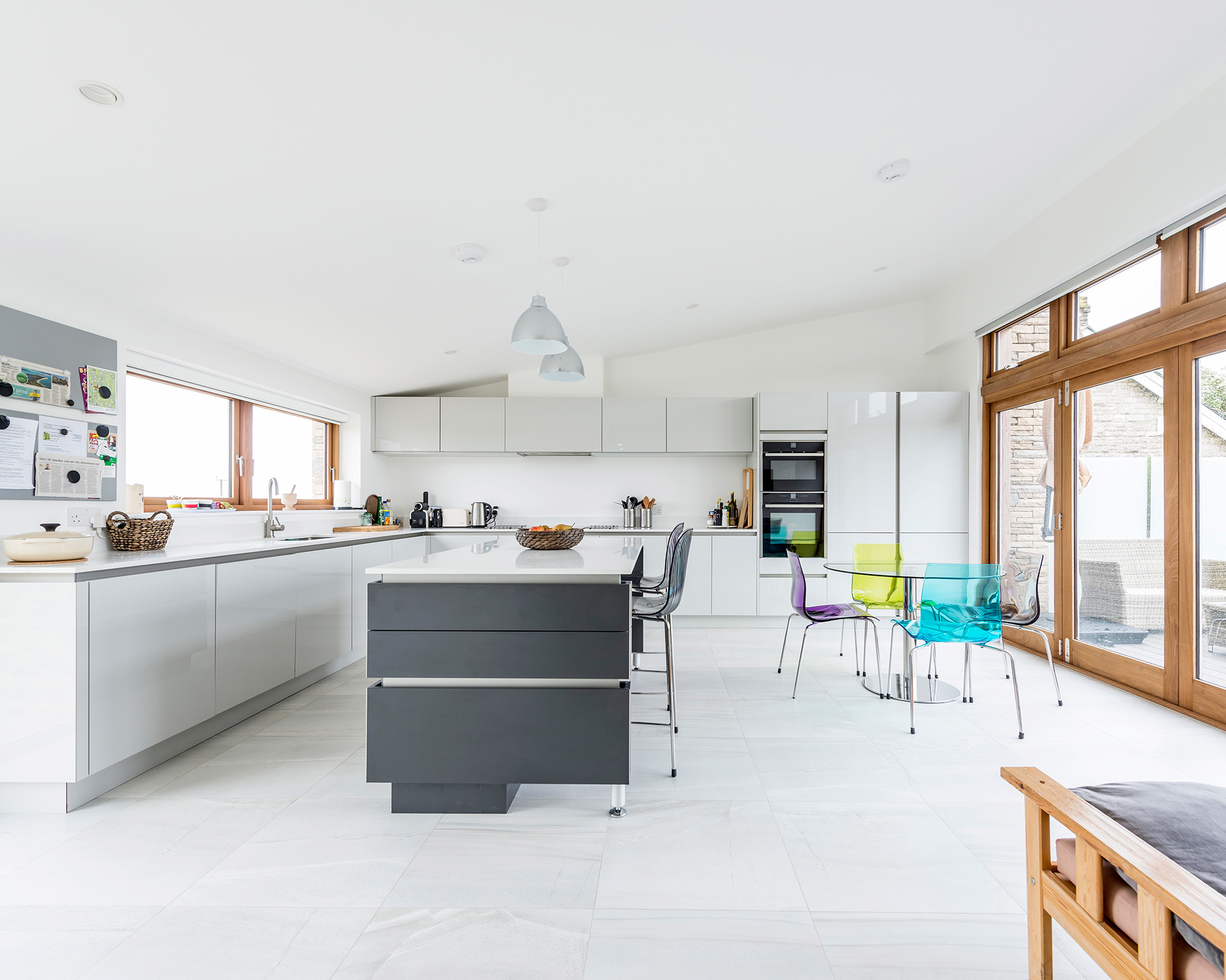 contemporary kitchen and dining area with patio doors