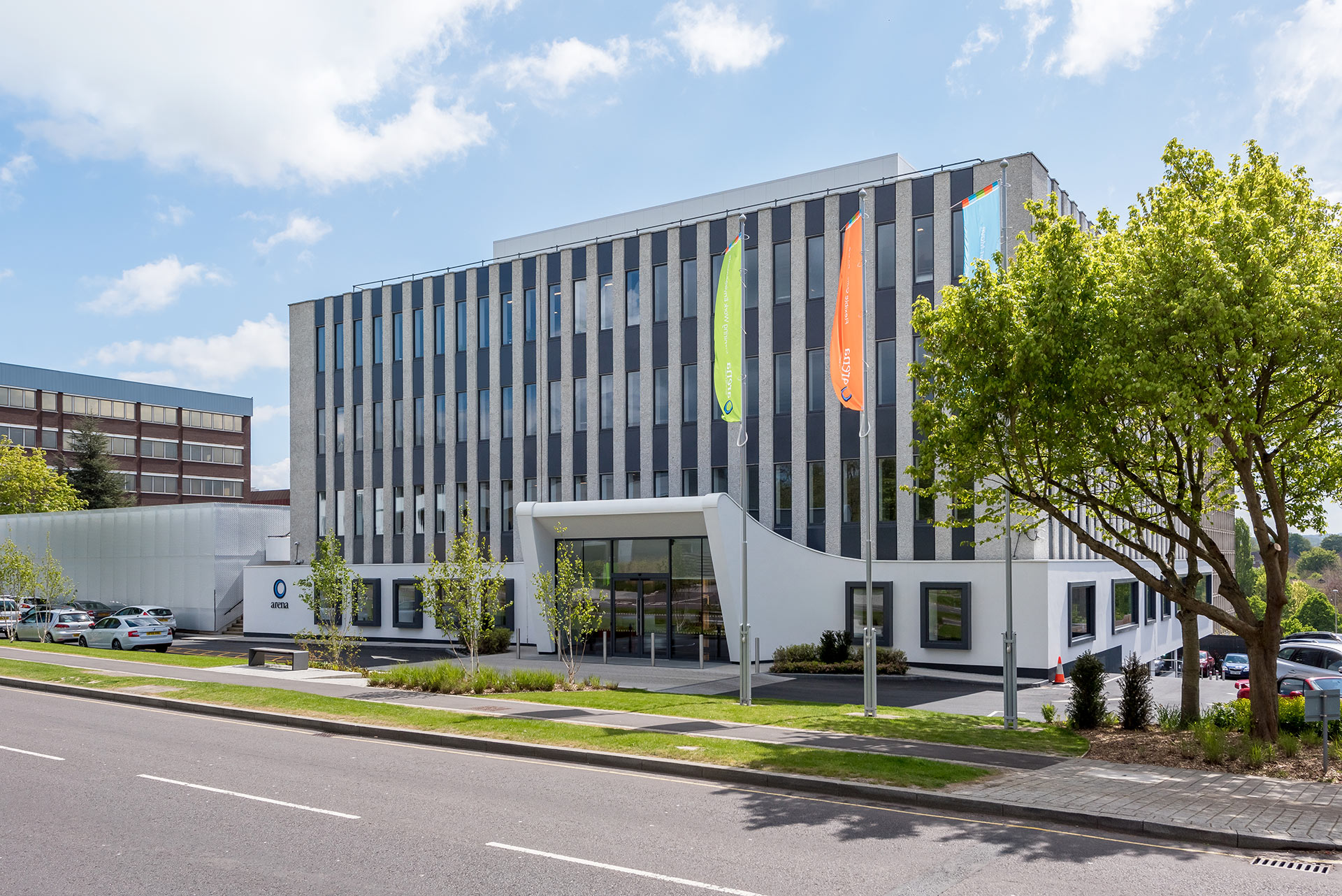 entrance area to white office building from across road