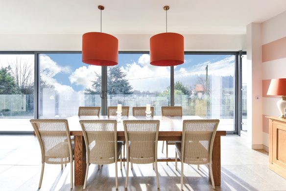 bright dining area with sliding doors leading to balcony