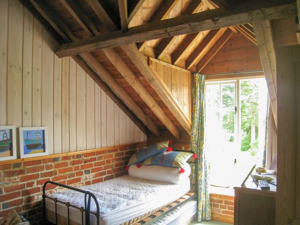 interior bedroom with single bed and appex roof window dormer window