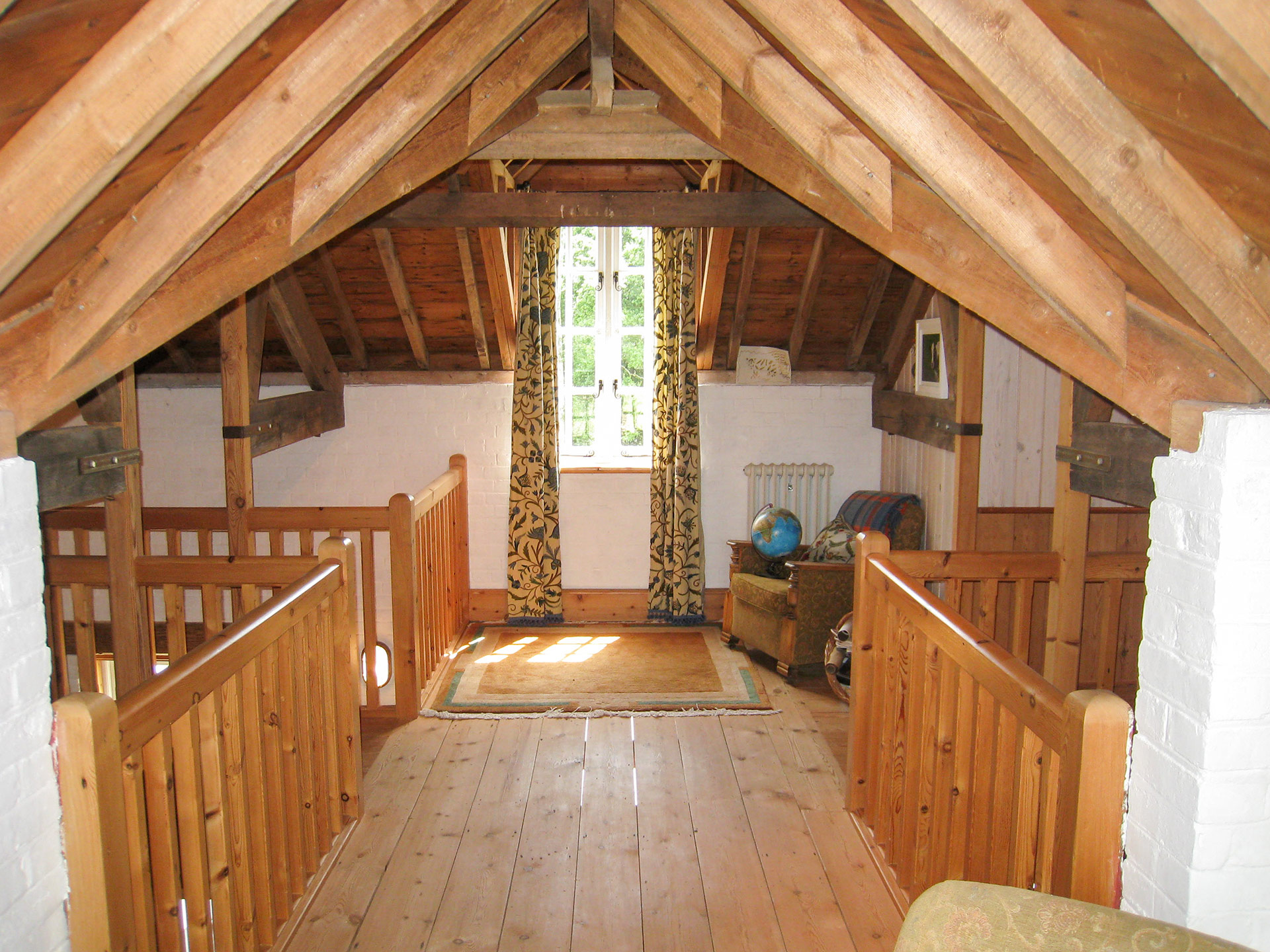 interior gallery area on first floor with wooden floor, balustrade and ceiling