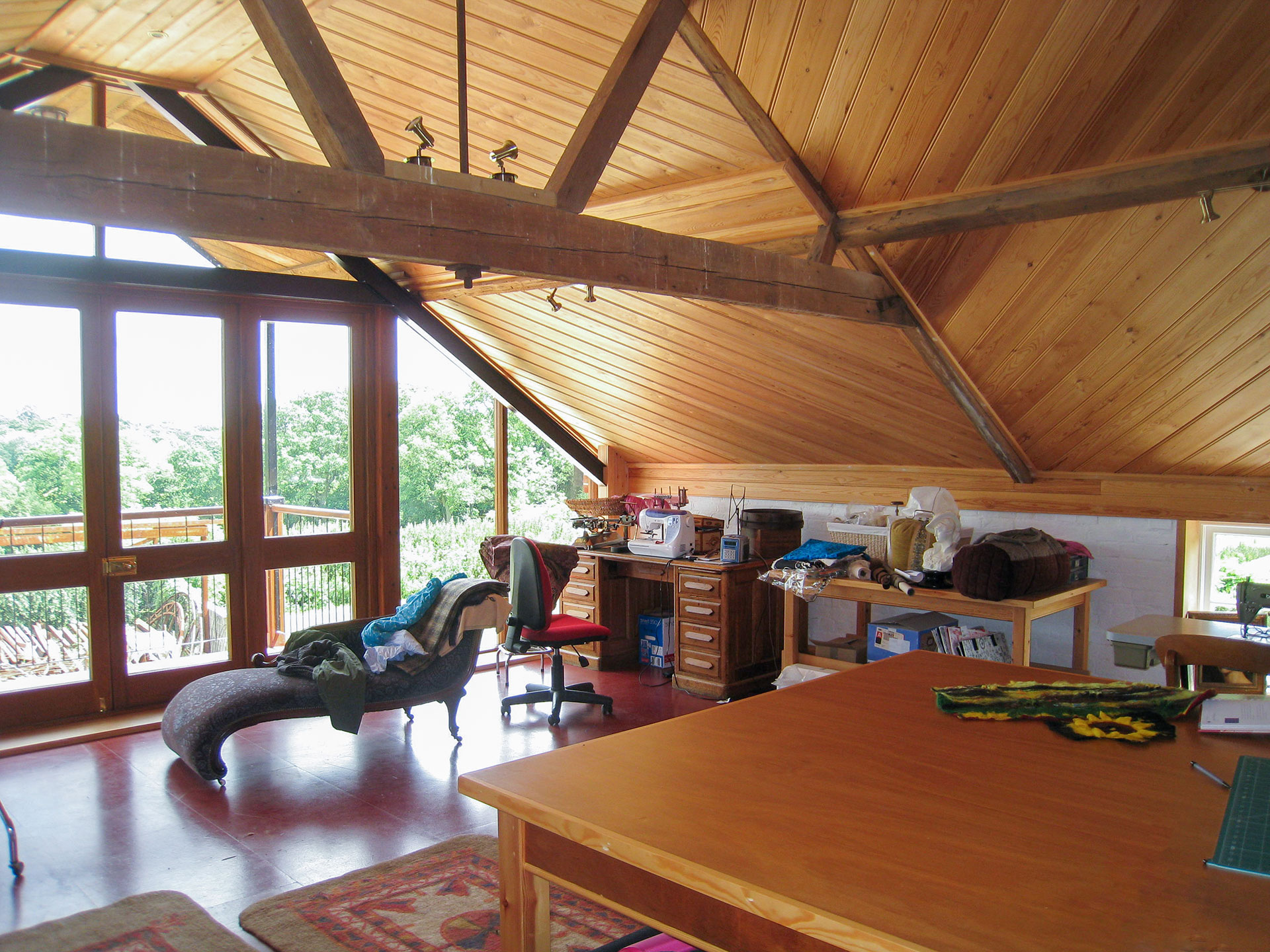 interior sewing room with doors leading to balcony