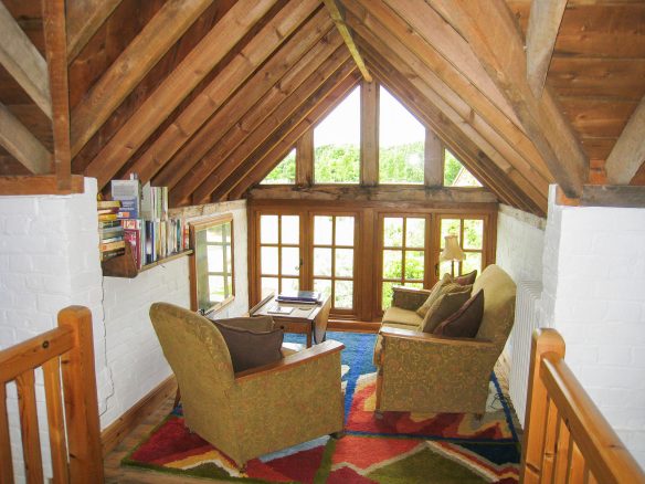 first floor seating area with exposed timber beams