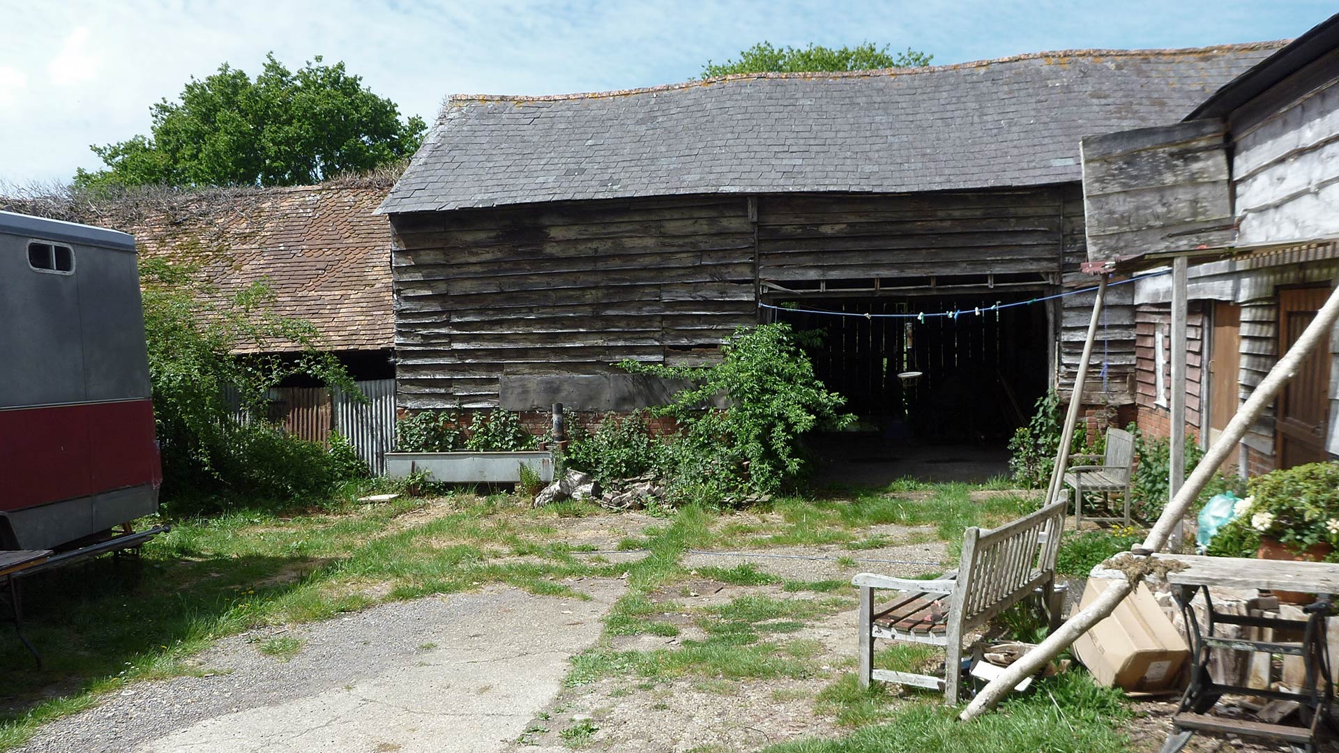 existing barn with wood cladding and tiled roof