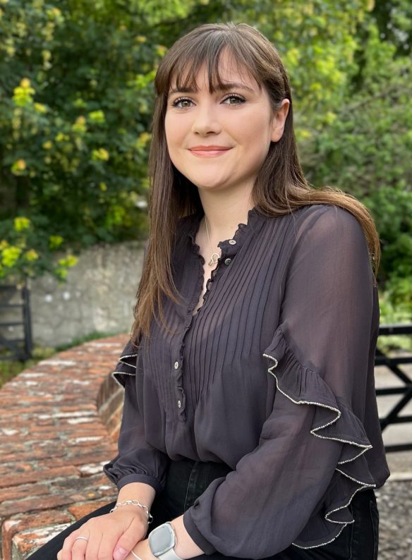 rebecca holden sitting on wall