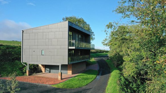 side view of house with zinc render and balconies