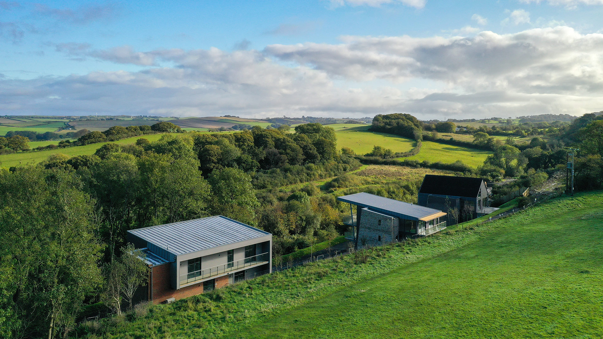 contemporary houses with different style roofs with beautiful countryside views