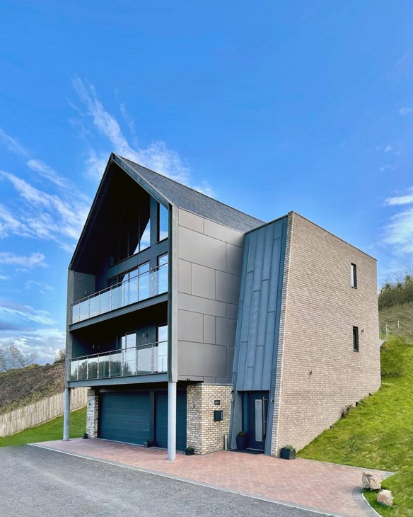 front view of new house with pitched roof and balconies