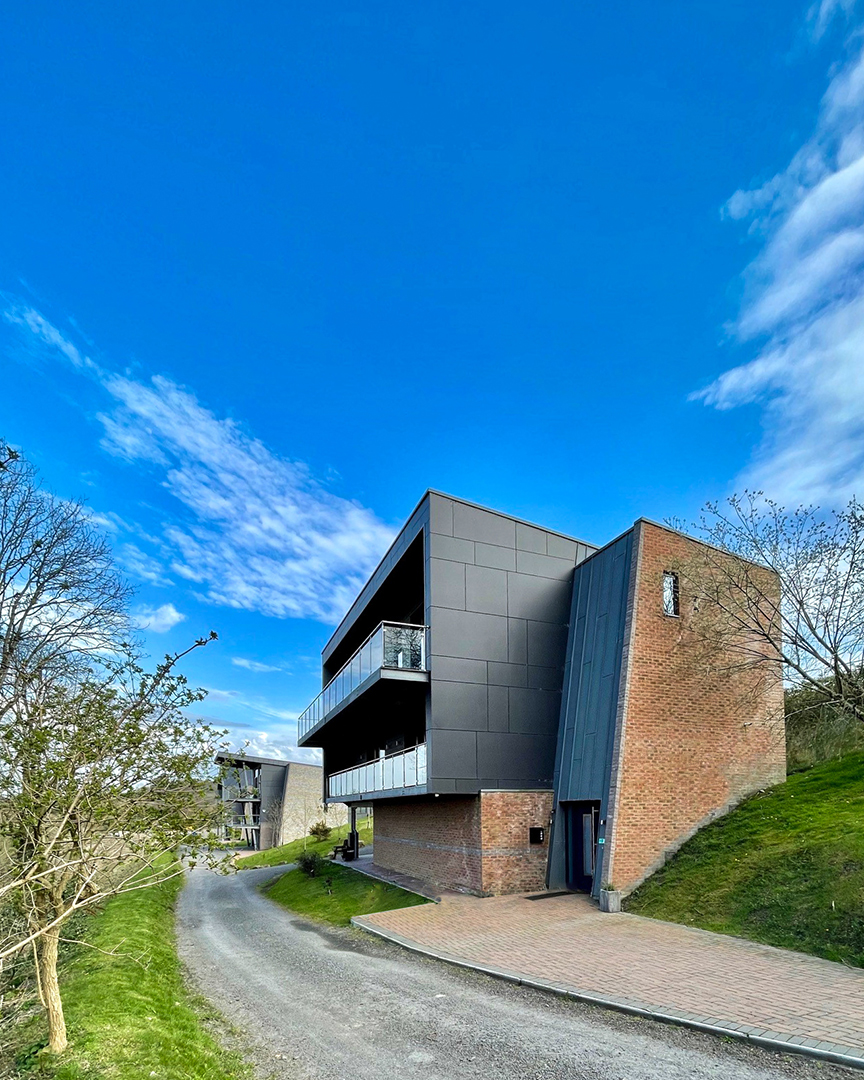 side view of new house with overlapping balconies