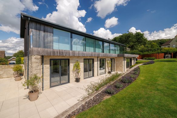 side view of contemporary house with sloping garden