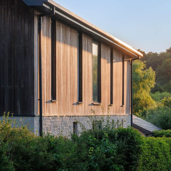 detail view of side of house with timber clad at sunset