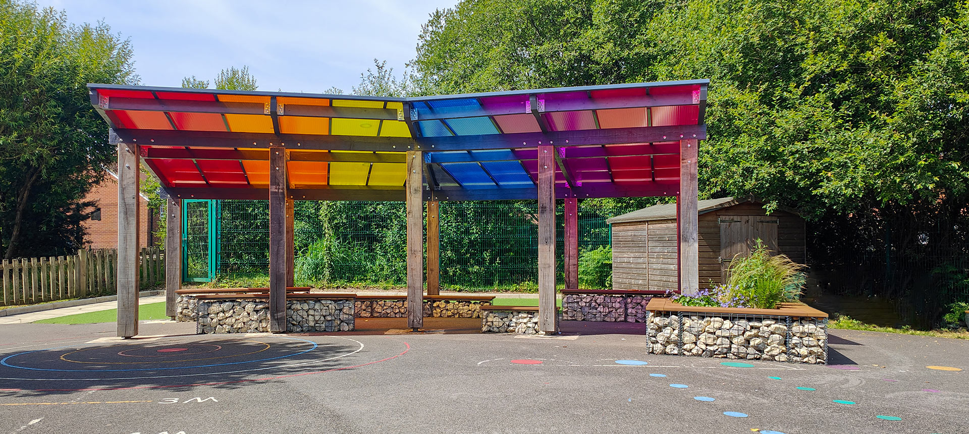 front view of shelter in school playground with multicolored roof